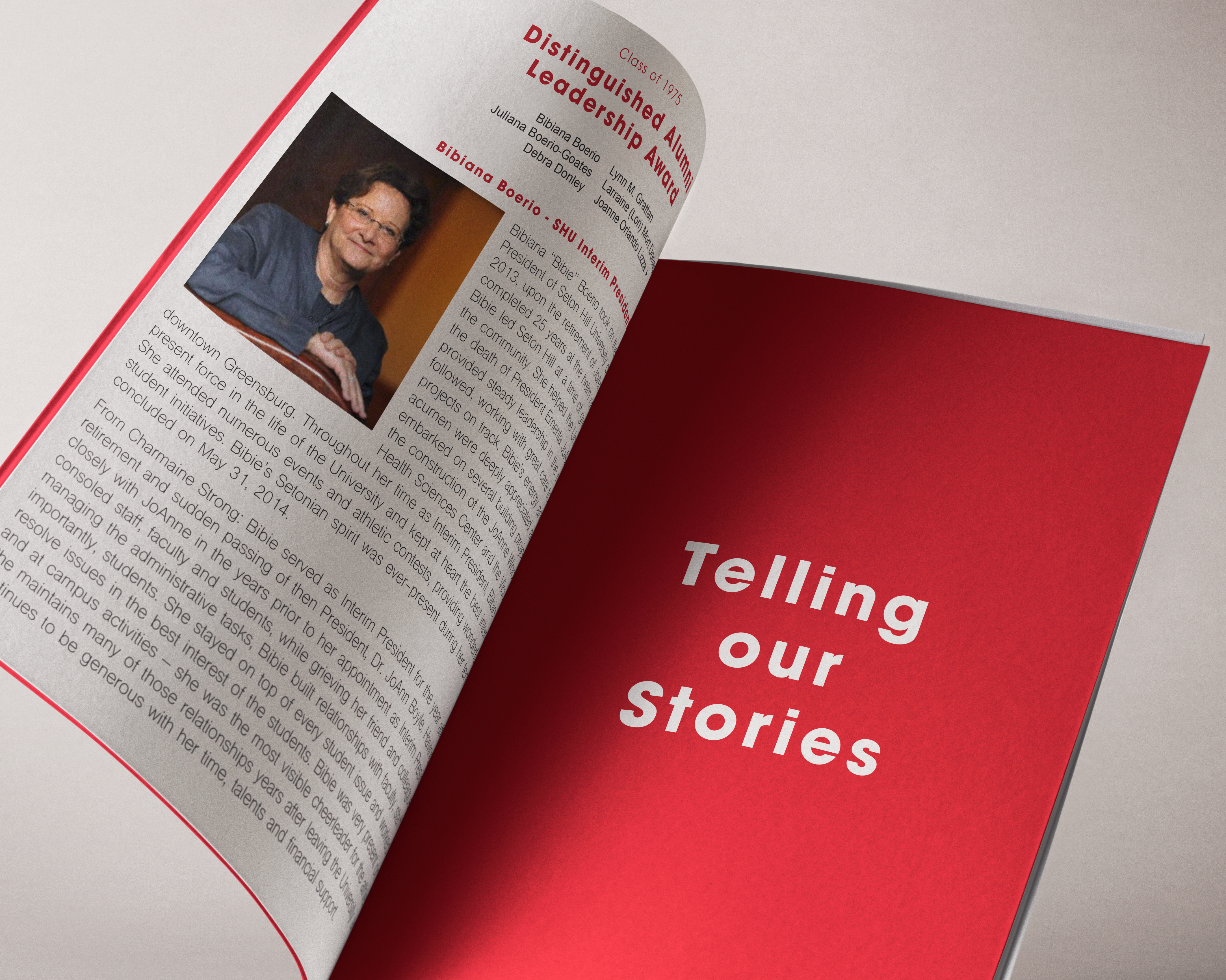 An open paperback book with the heading 'Telling 0ur Stories'. 